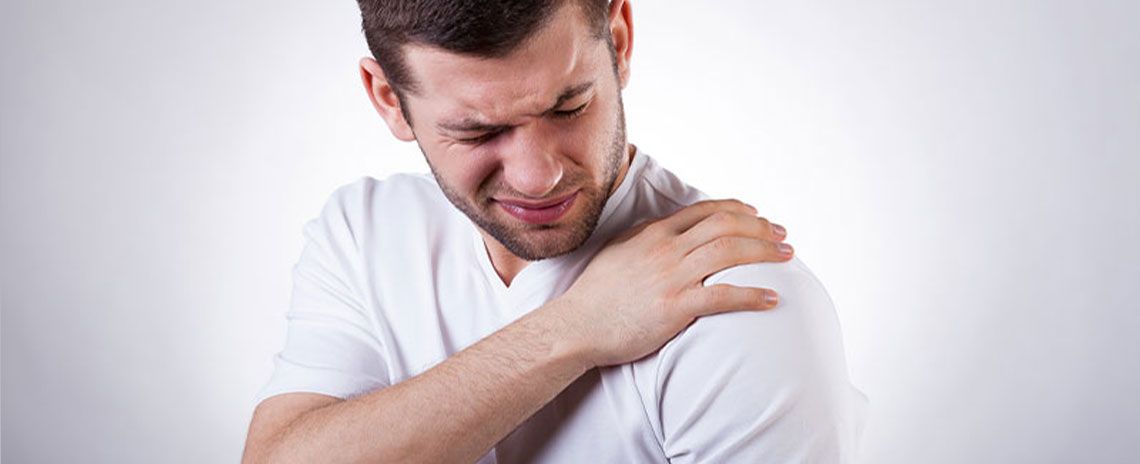 Man suffering with frozen shoulder in need of a chiropractic adjustment at Center For Auto Accident Injury Treatment in San Diego