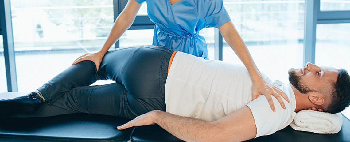 Male patient receiving chiropractic treatment for sciatica at Center For Auto Accident Injury Treatment in San Diego