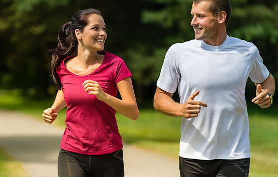 Couple jogging together to get healthy in San Diego