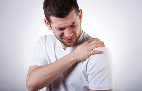 Man suffering with frozen shoulder in need of a chiropractic adjustment at Center For Auto Accident Injury Treatment in San Diego