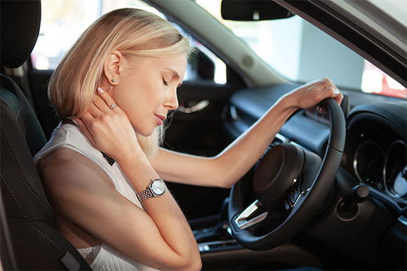 Woman in need of auto accident injury care at Center For Auto Accident Injury Treatment in San Diego after an auto accident resulting in whiplash